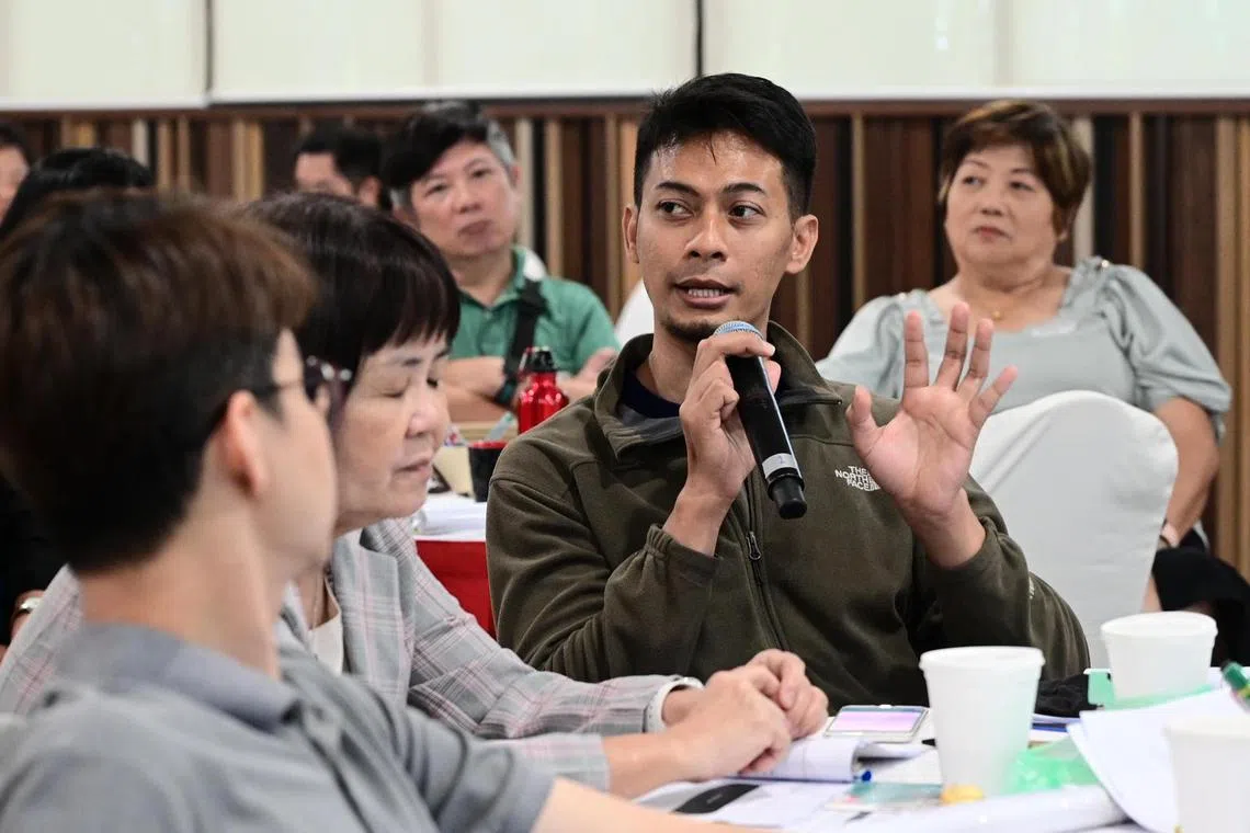 Grassroots leaders in the North West district like Mr Muhammad Haizuruldin Gimin (centre) are being trained to engage residents with mental health struggles.
