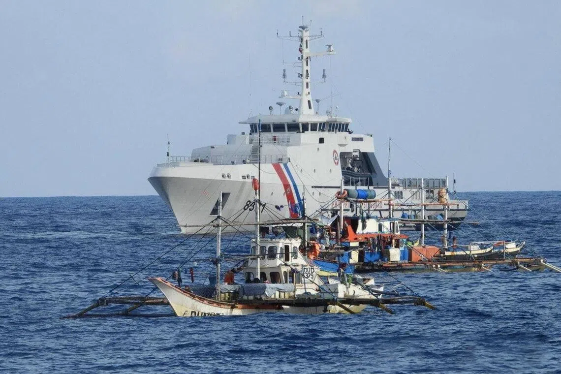 A Philippine Coast Guard vessel was among the government ships sending supplies to 40 Filipino fishing boats at Scarborough Shoal in the disputed South China Sea on September 16, 2025. 
