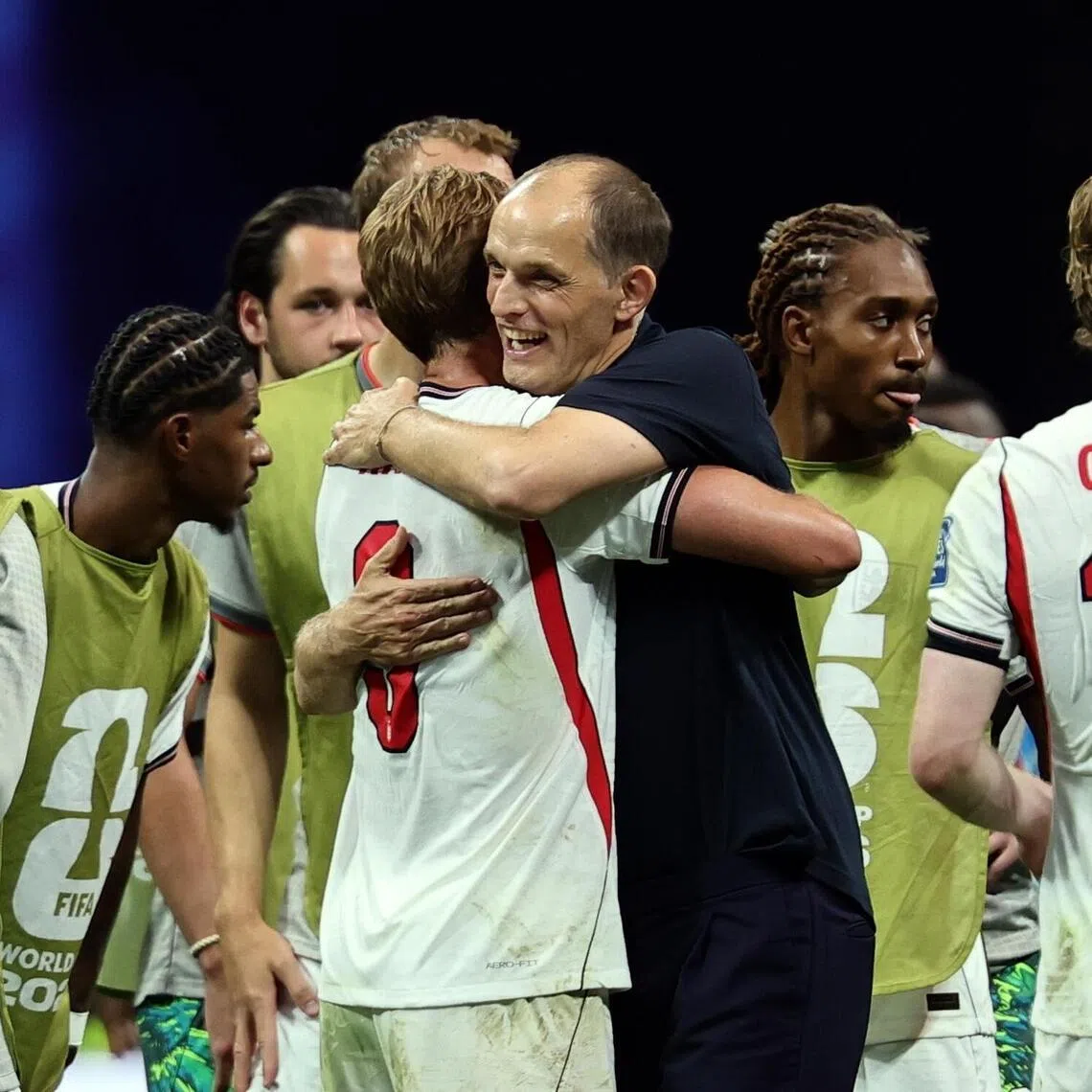 England coach Thomas Tuchel (in black) hugging goal scorer Harry Kane on July 1.