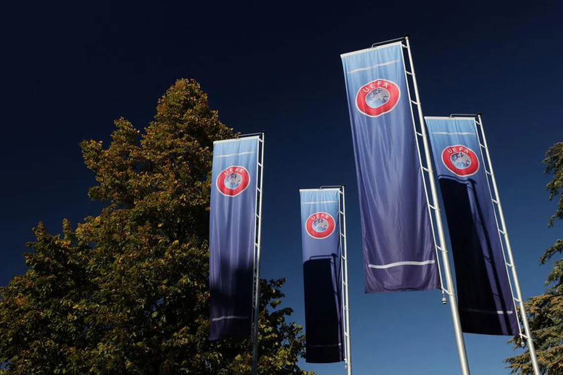 Flags with UEFA logo are seen outside of the Union of European Football Associations headquarters in Nyon, Switzerland, October 5, 2022. REUTERS/Denis Balibouse/File Photo