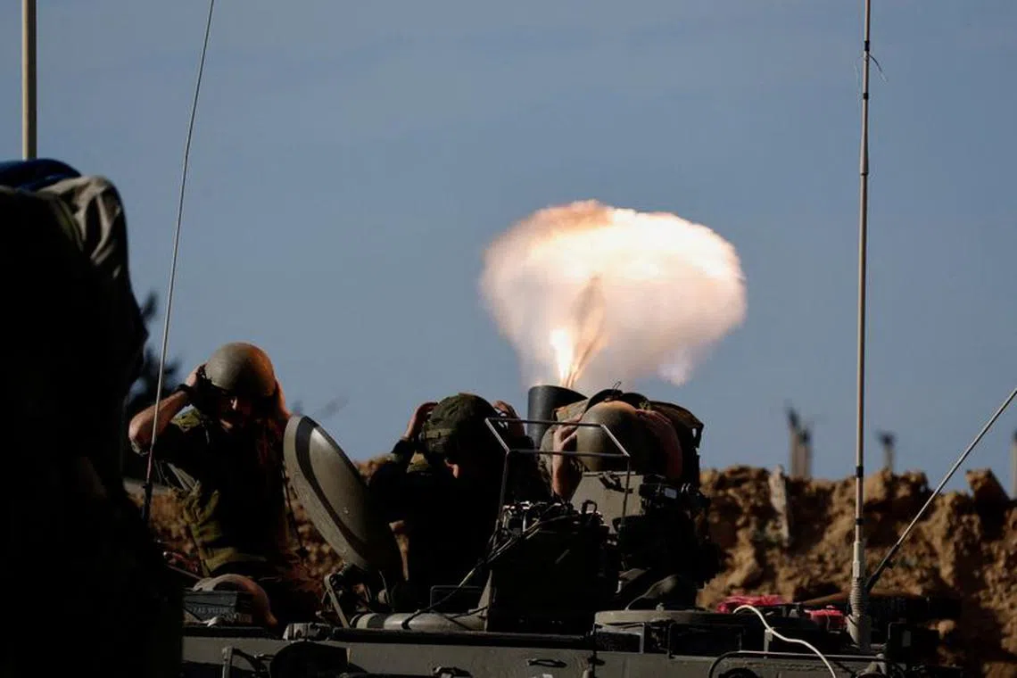 Israeli soldiers fire a mortar, as the conflict continues between Israel and the Palestinian Islamist group Hamas, on the border with the central Gaza, Israel January 22, 2024. REUTERS/Amir Cohen