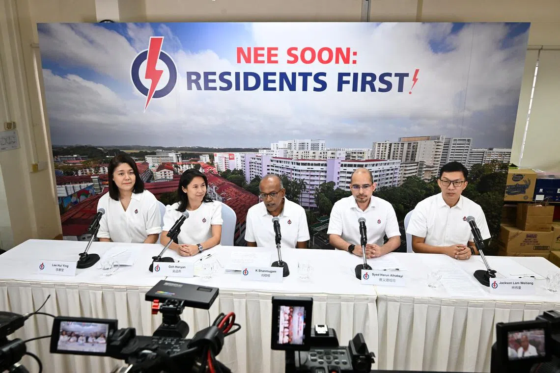 Law and Home Affairs Minister K. Shanmugam with (from left) Ms Lee Hui Ying, Ms Goh Hanyan, Dr Syed Harun Alhabsyi and Mr Jackson Lam at the PAP’s Chong Pang branch on April 21.
