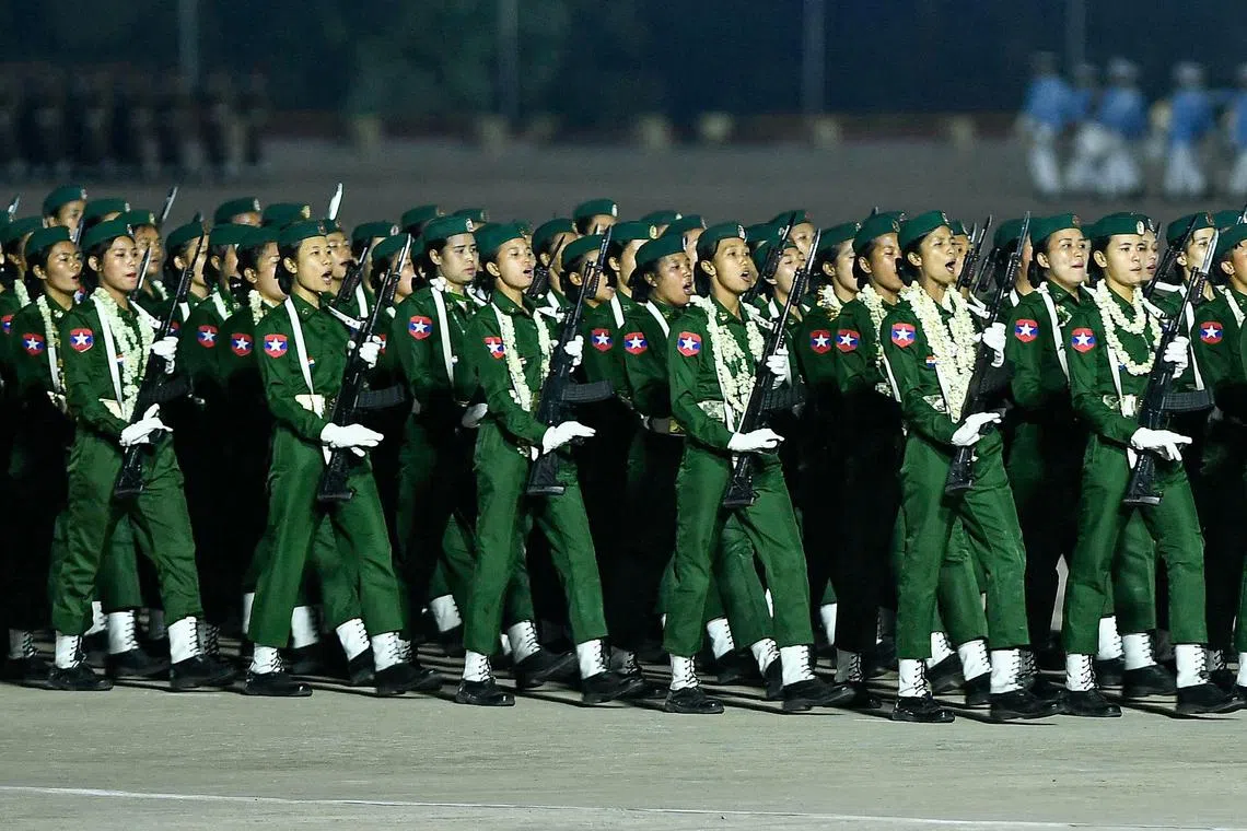 Myanmar junta military soldiers parade during a ceremony to mark the country's Armed Forces Day in Naypyidaw on March 27, 2024. Myanmar's junta chief on March 27, 2024 blamed the country's growing armed resistance movement for preventing long-promised elections in a speech to thousands of soldiers following an Armed Forces Day parade. (Photo by AFP)