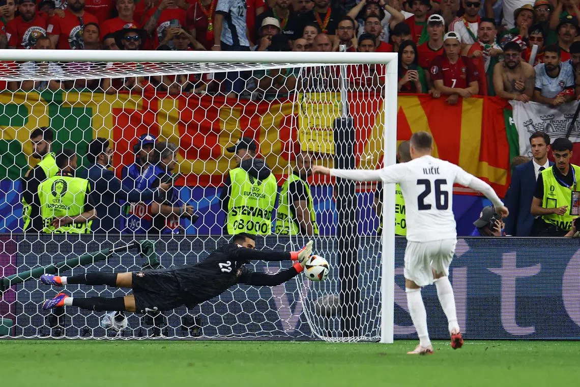 FILE PHOTO: Soccer Football - Euro 2024 - Round of 16 - Portugal v Slovenia - Frankfurt Arena, Frankfurt, Germany - July 1, 2024  Portugal's Diogo Costa saves a penalty during the shootout missed by Slovenia's Josip Ilicic REUTERS/Lee Smith/File Photo