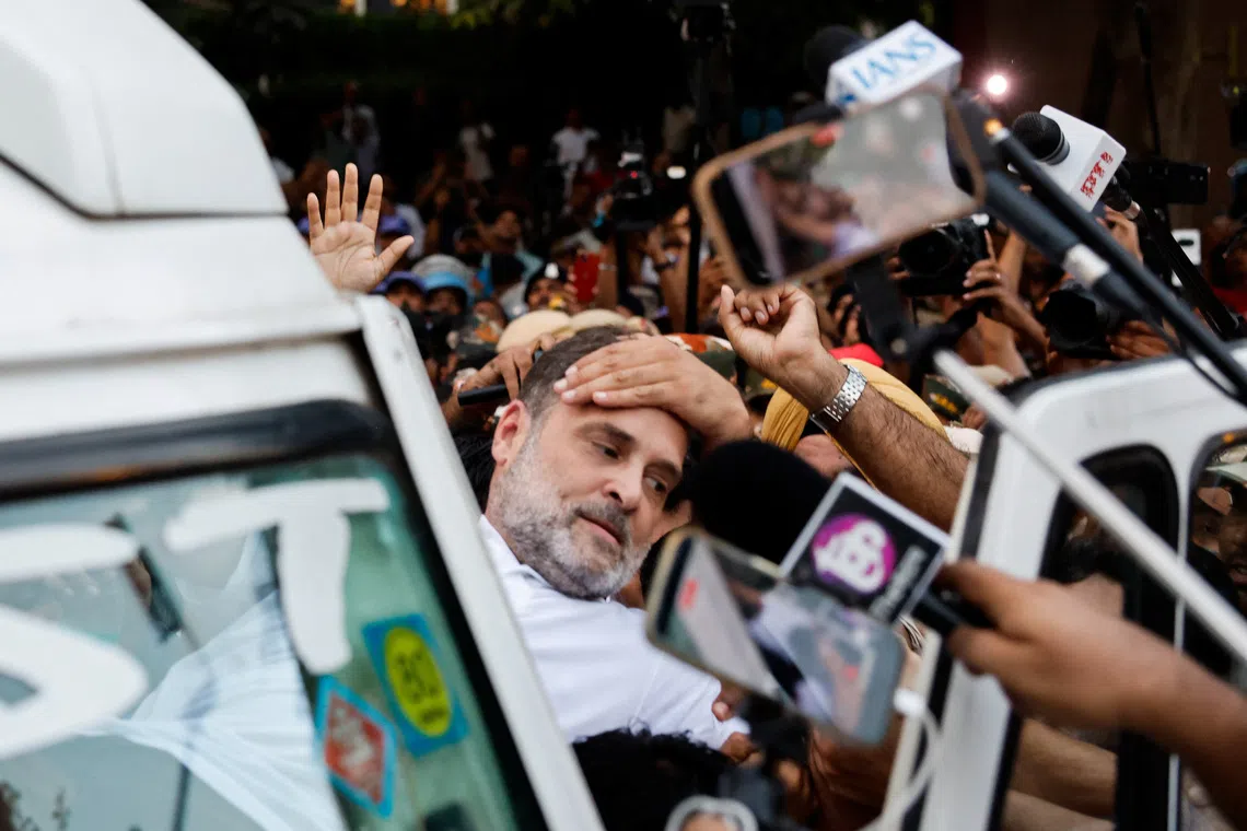 Indian opposition leader Rahul Gandhi is detained by police in New Delhi on Oct 7.