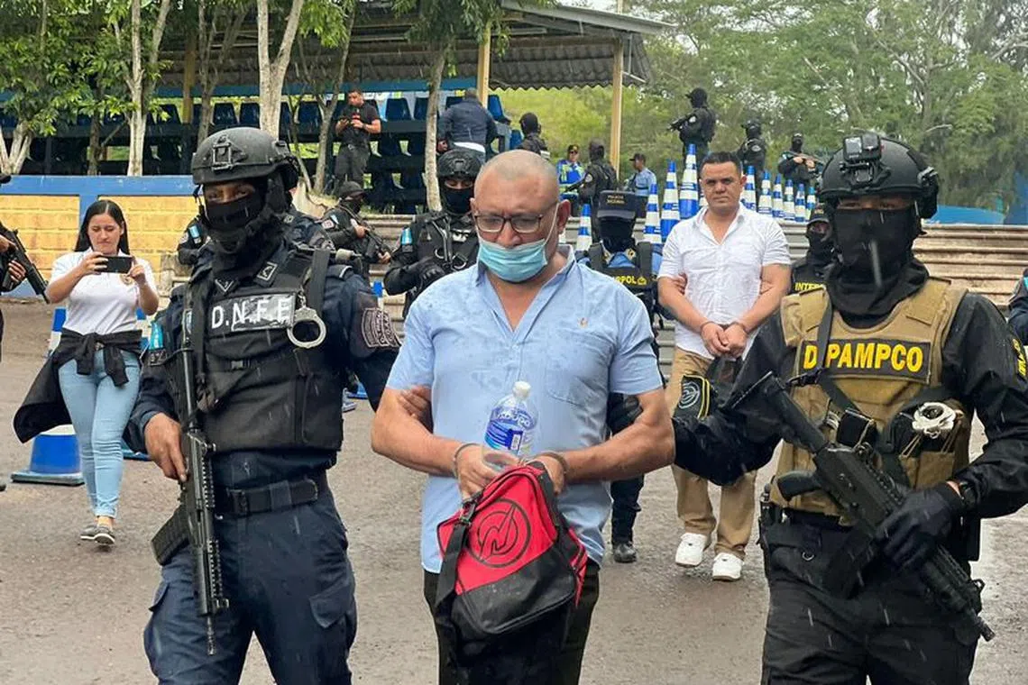 Mara Salvatrucha leader David Elias Campbell Licona, known as \"El Viejo Dan\", is escorted by Honduras law enforcement officers before being deported to Nicaragua, in Tegucigalpa, Honduras, November 5, 2023. Secretaria de Seguridad del Gobierno de Honduras/Handout via REUTERS