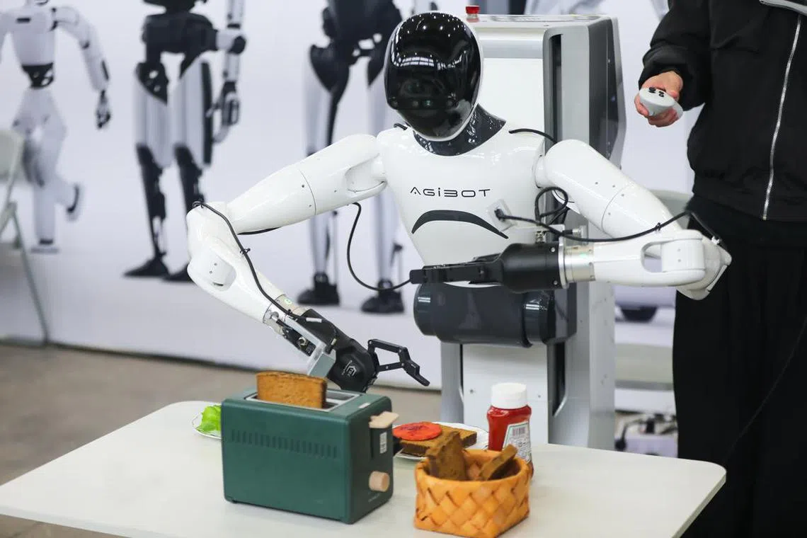 A robot developed by AgiBot, an artificial intelligence and robotics start-up, makes toast at the 2025 Global Developer Conference in Shanghai on Feb 21.