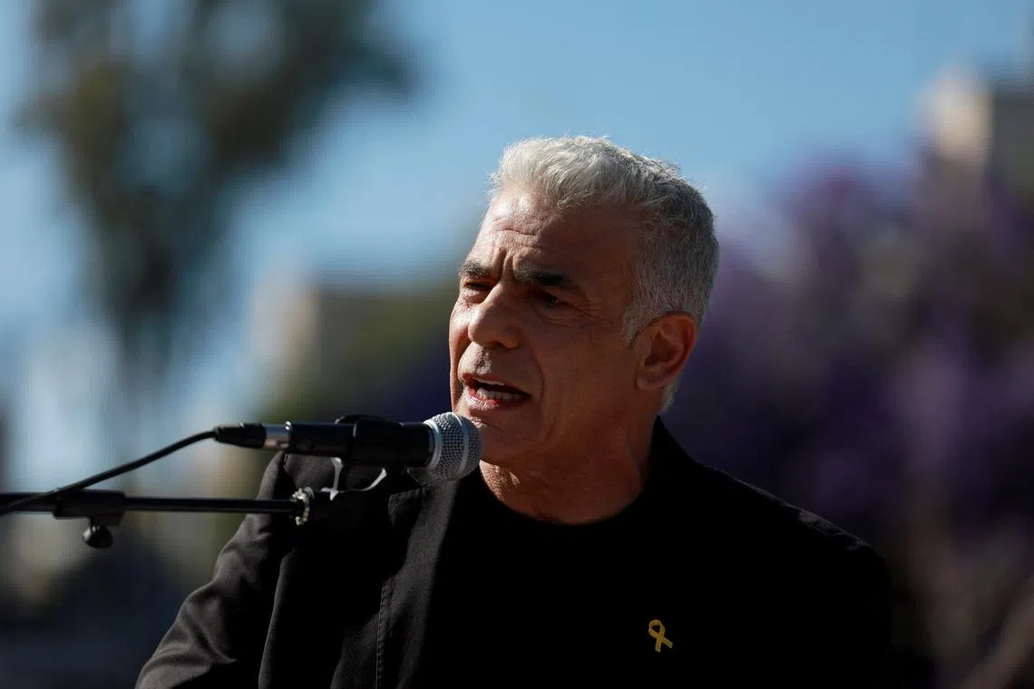 Israeli opposition leader Yair Lapid speaks during an annual Pride and Tolerance March, under the slogan \"Born to be Free\" calling for the swift return of hostages seized during the deadly October 7 attack by Palestinian Islamist group Hamas from Gaza, in Jerusalem, May 30, 2024. REUTERS/Ammar Awad/File Photo