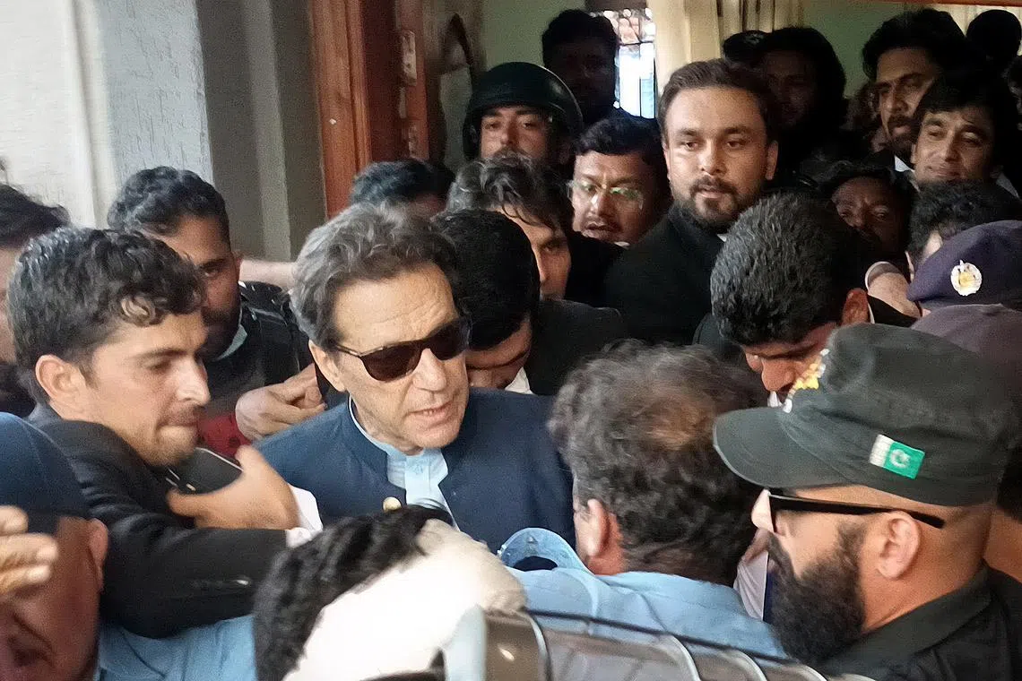 Former Prime Minister Imran Khan (centre) arrives at Islamabad High Court as he was granted two-week bail.