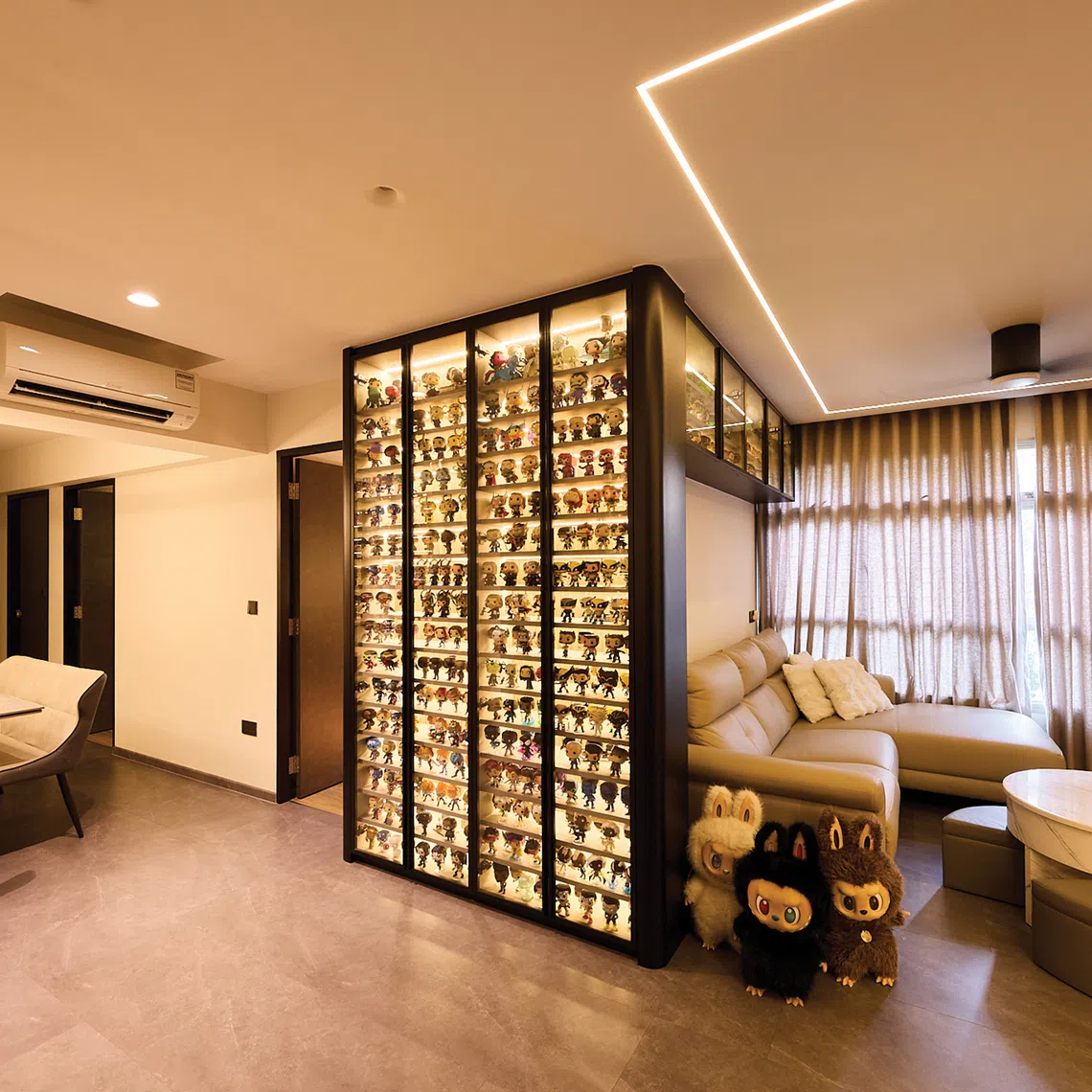 This family home’s palette is simple and monochromatic to better showcase the owners’ vast toy collection.