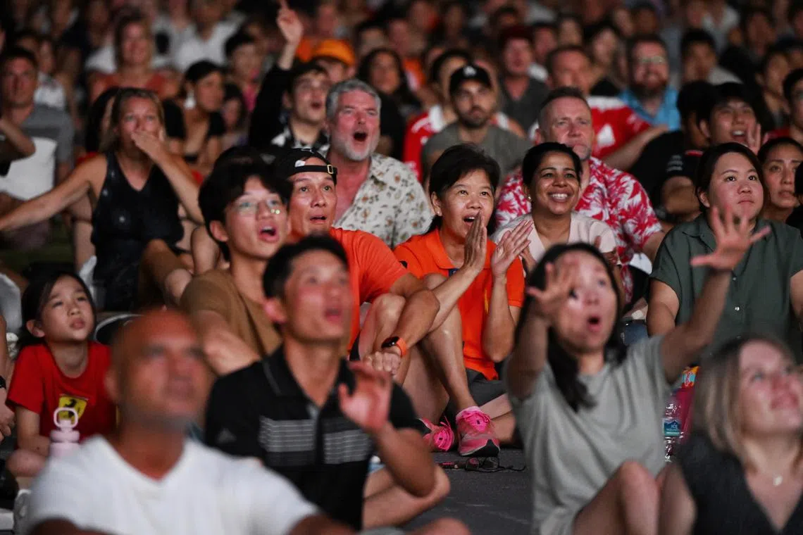 Spectators watching the live telecast of the race at Padang on the final day of the Singapore Grand Prix on Sept 17. 