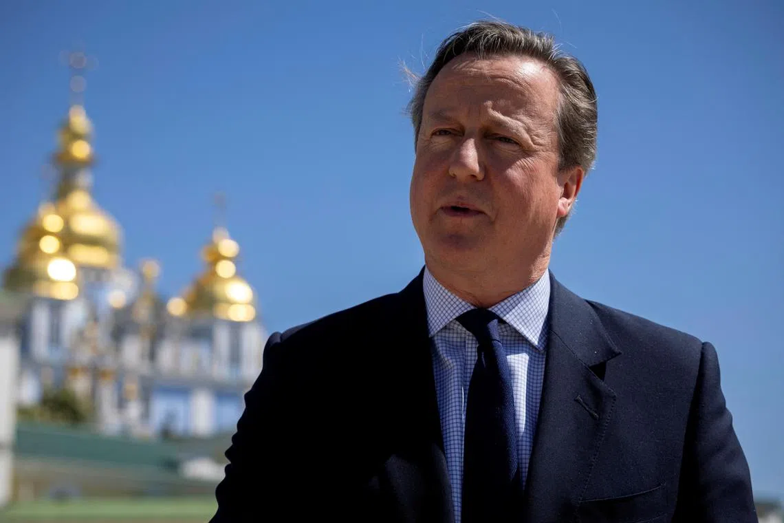 Foreign Secretary David Cameron speaks to a reporter outside St. Michael's Golden-Domed Monastery, amid Russia's attack on Ukraine, in Kyiv, Ukraine, May 2, 2024. REUTERS/Thomas Peter/Pool