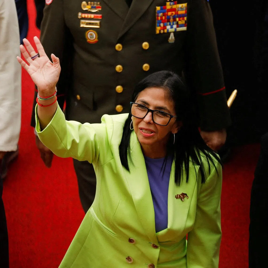 FILE PHOTO: Venezuela's interim president Delcy Rodriguez waves as she walks to deliver her first annual address to the nation at the National Assembly, following the U.S. strike in Caracas that resulted in the capture of President Nicolas Maduro and his wife, Cilia Flores, in Caracas, Venezuela, January 15, 2026. REUTERS/Leonardo Fernandez Viloria/File Photo