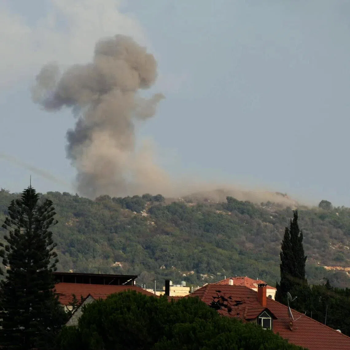 Smoke rising from the site of Israeli air strikes targeting the strategic Ali al-Taher Ridge in southern Lebanon on Aug 14.
