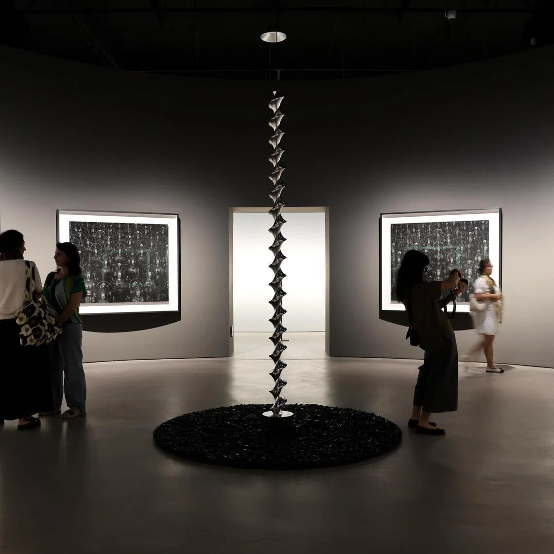 ST20260526_202660800933/Sarah Lee/cxart

Generic photo of Hiroshi Sugimoto's Mathematical Model 002: Dini’s Surface (2005, spiral sculpture) and Sea of Buddha (1995, photographs on wall), as part of Hiroshi Sugimoto: Form Is Emptiness, the artist's first solo exhibition in Southeast Asia, at the Singapore Art Museum. Photographed on May 26, 2026. ST PHOTO: SARAH LEE