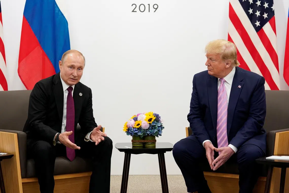 FILE PHOTO: Russia's President Vladimir Putin gestures during a bilateral meeting with U.S. President Donald Trump at the G20 leaders summit in Osaka, Japan, June 28, 2019.  REUTERS/Kevin Lamarque/File Photo