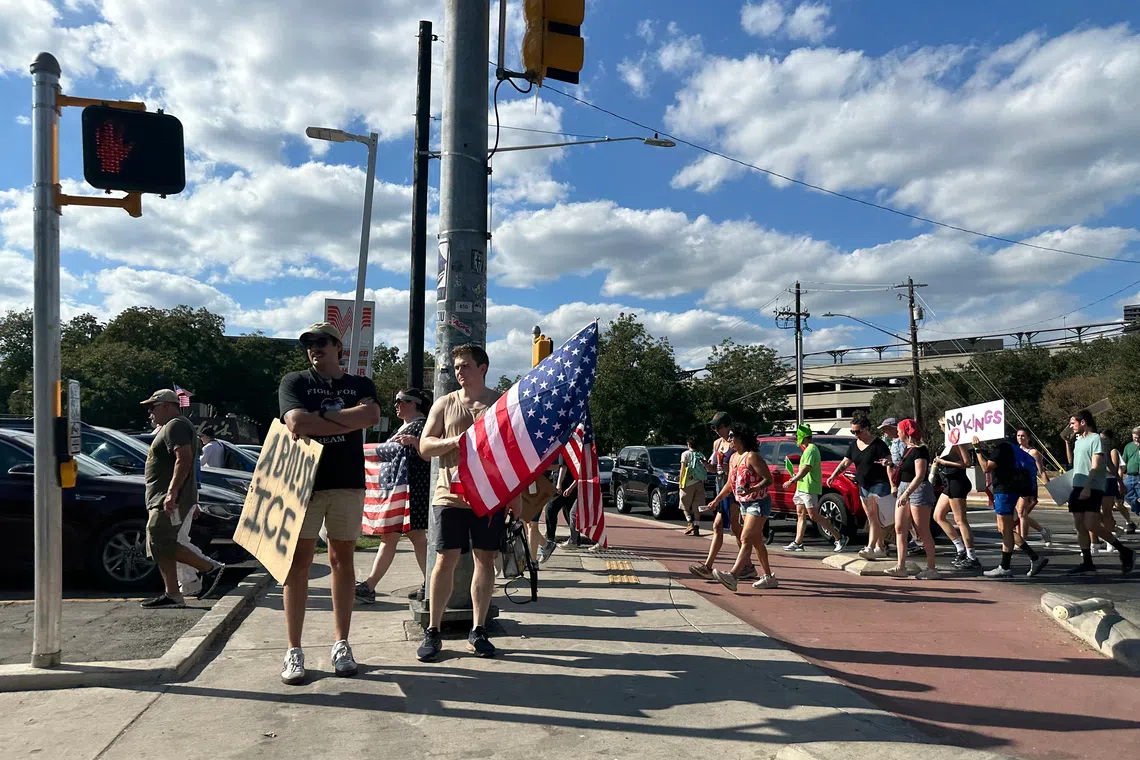 ‘He thinks he’s great, we don’t’: Americans march against Trump’s ‘imperial presidency’