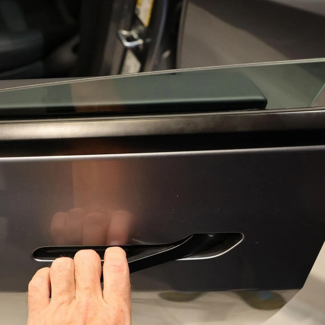 Invisible door handles, a design popularised by Tesla, are designed to sit flush against the car’s body for a minimalist look.