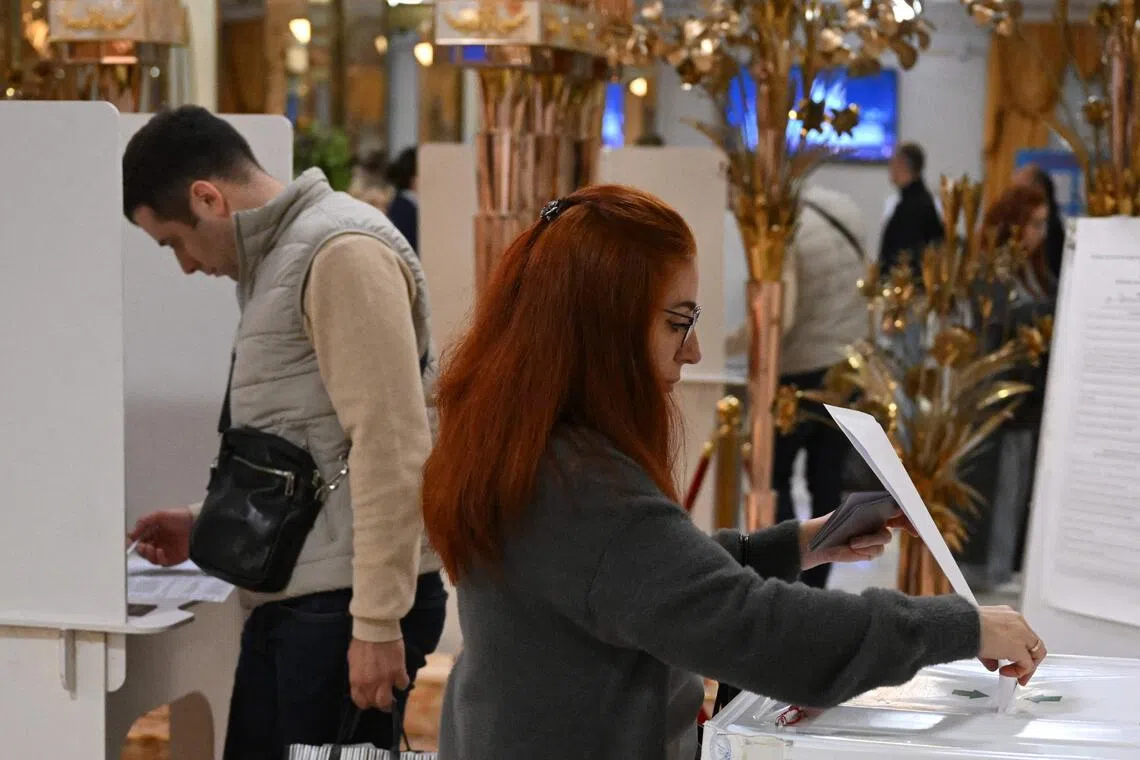 Russians begin voting in controlled election as war drags on