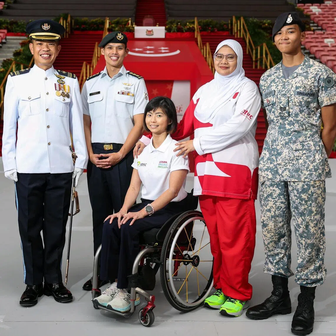 (From left) NDP parade commander, Military Expert 6 Caleb Chia, NDP parade and ceremony committee chairman Colonel Anthony Lau, the Singapore Disability Sports Council’s contingent commander Yap Qian Yin, NTUC contingent member Siti Radziah Zainal Abidin, and her son Ari Wafiy Muhammad Mahfudz, who will join the National Cadet Corps (Sea) contingent.