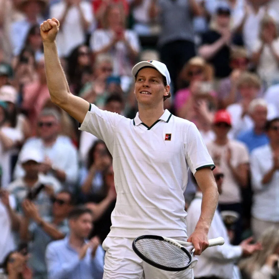 Italy's Jannik Sinner celebrates beating Serbia's Novak Djokovic during their men's singles semi-final tennis match on the twelfth day of the 2026 Wimbledon Championships at The All England Lawn Tennis and Croquet Club in Wimbledon, southwest London, on July 10, 2026. (Photo by Kirill KUDRYAVTSEV / AFP) / RESTRICTED TO EDITORIAL USE