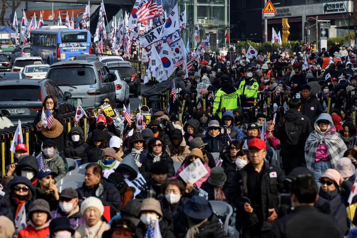 Supporters of South Korea president Yoon Suk Yeol gather outside the presidential residence in Seoul on April 4.