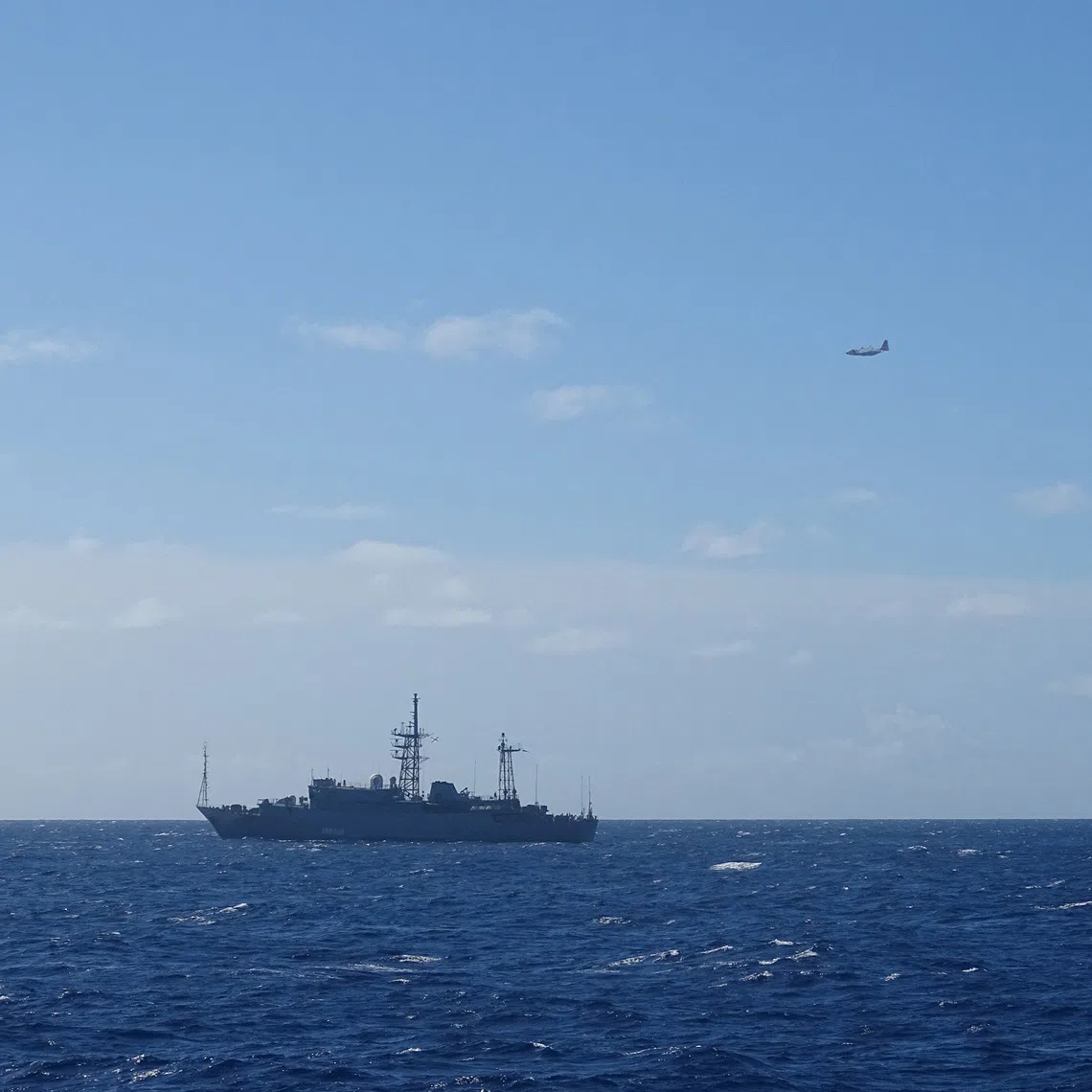 A Coast Guard HC-130 Hercules airplane crew from Air Station Barbers Point monitors a Russian military vessel, south of Oahu, Hawaii, U.S., October 29, 2025.  U.S. Coast Guard/Cutter William Hart/Handout via REUTERS  THIS IMAGE HAS BEEN SUPPLIED BY A THIRD PARTY