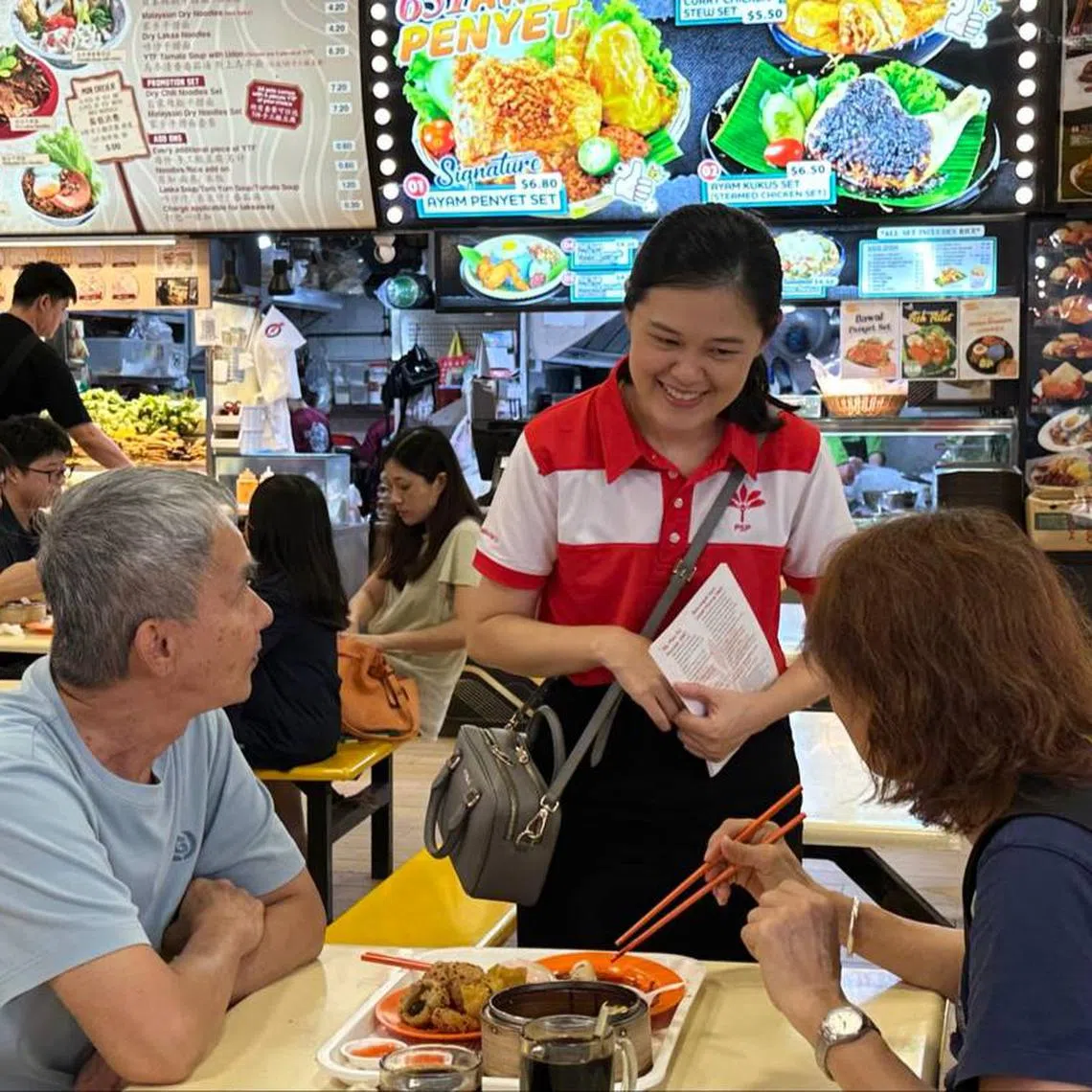 Progress Singapore Party candidate Stephanie Tan speaking to residents during a walkabout in Pioneer on April 26.
