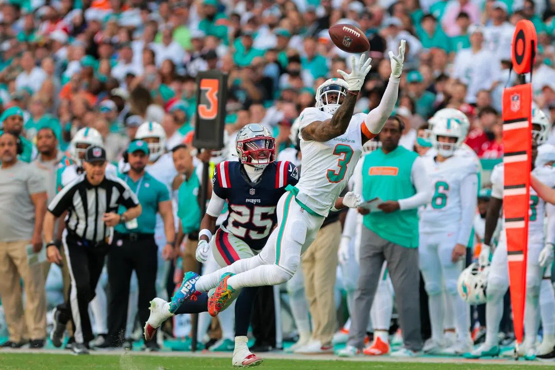 Nov 24, 2024; Miami Gardens, Florida, USA; Miami Dolphins wide receiver Odell Beckham Jr. (3) dives but cannot make a catch against New England Patriots cornerback Marcus Jones (25) during the third quarter at Hard Rock Stadium. Mandatory Credit: Sam Navarro-Imagn Images/ File Photo