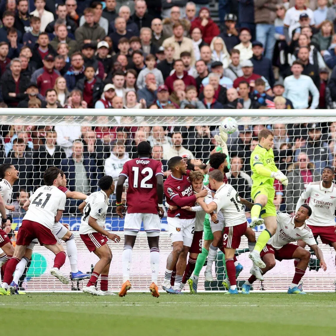 West Ham United and Arsenal players tussling in the penalty area during the corner which led to the Hammers' disallowed goal, as the Gunners claimed a 1-0 EPL win on May 10. 