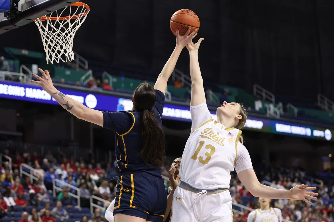 FILE PHOTO: Mar 7, 2025; Greensboro, NC, USA;  Notre Dame Fighting Irish forward Kate Koval (13) shoots the ball and is blocked during the fourth quarter by California Golden Bears forward Marta Suarez (7) at First Horizon Coliseum. Mandatory Credit: Cory Knowlton-Imagn Images/File Photo