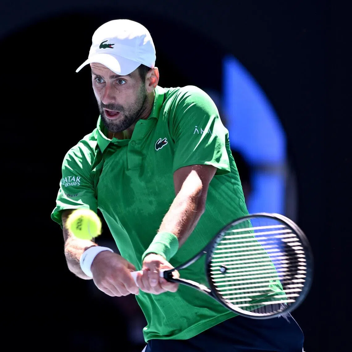 Novak Djokovic battling against Francesco Maestrelli of Italy in their match at the Australian Open.