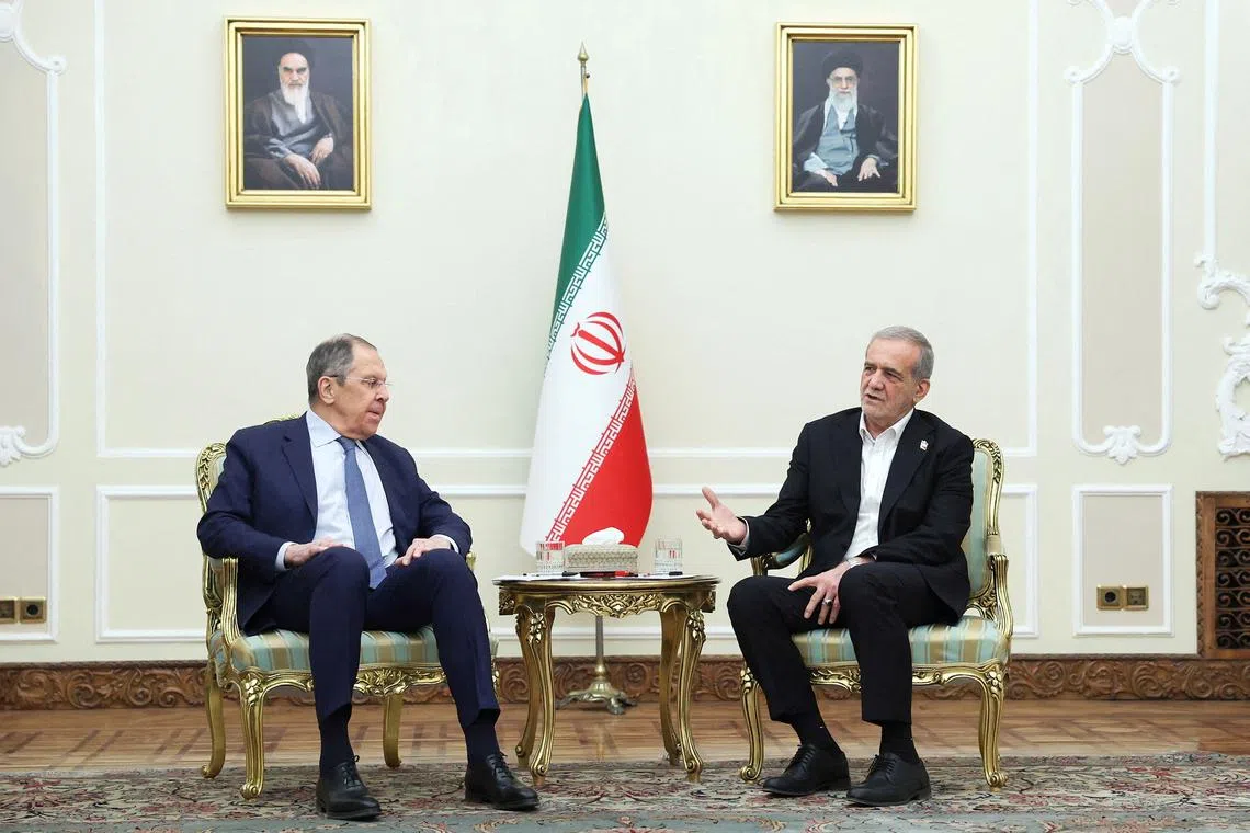 Iranian President Masoud Pezeshkian meets with Russia's Foreign Minister Sergei Lavrov in Tehran, Iran, February 25, 2025. Iran's Presidential website/WANA (West Asia News Agency)/Handout via REUTERS