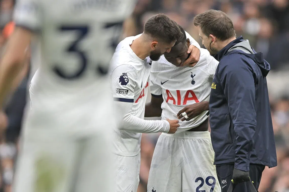 Tottenham Hotspur's Rodrigo Bentancur (left) comforting the injured Pape Matar Sarr during the Premier League match against Bournemouth on Dec 31.