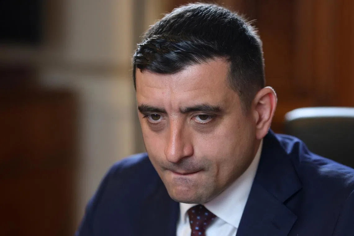 FILE PHOTO: Far-right opposition leader and presidential candidate George Simion answers questions during an interview with Reuters, in Bucharest, Romania, May 2, 2025. Inquam Photos/George Calin via REUTERS