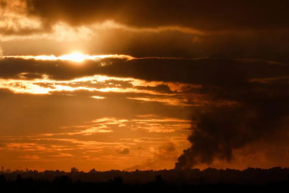Smoke rises in north Gaza, amid the ongoing conflict between Israel and the Palestinian Islamist group Hamas, as seen from Israel, January 2, 2024. REUTERS/Amir Cohen/ File Photo