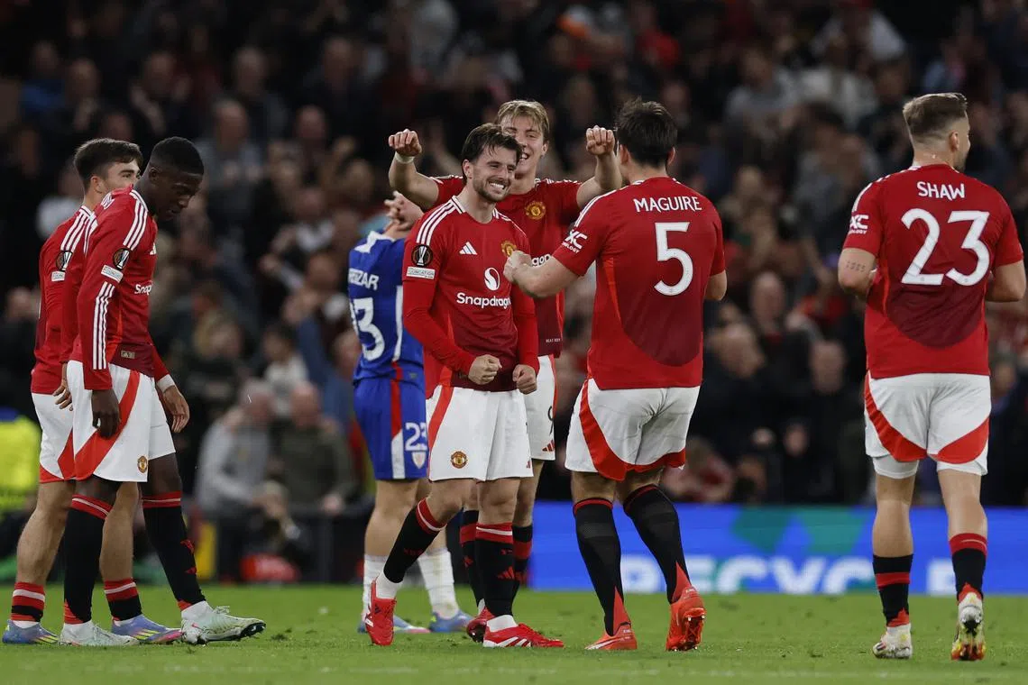 Soccer Football - Europa League - Semi Final - Second Leg - Manchester United v Athletic Bilbao - Old Trafford, Manchester, Britain - May 8, 2025 Manchester United's Mason Mount celebrates scoring their fourth goal with Harry Maguire Action Images via Reuters/Jason Cairnduff