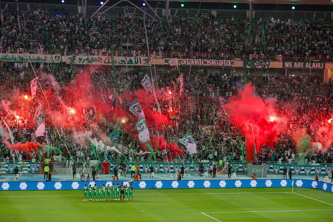 Al-Ahli players and fans at the Prince Abdullah Al Faisal Stadium on the opening day of the Saudi Pro League on Aug 11.