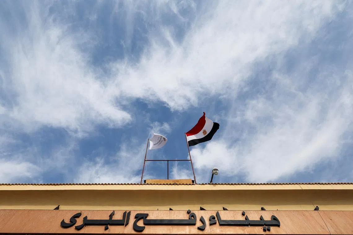 FILE PHOTO: An Egyptian flag waves on a gate at the Rafah border crossing, amid a ceasefire between Israel and Hamas, in Rafah, Egypt, January 28, 2025. REUTERS/Amr Abdallah Dalsh/File Photo