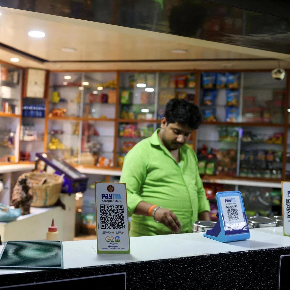 QR codes for digital payment at a grocery store in Ahmedabad in 2024. India has emerged as the second-largest e-retail market after China by number of shoppers. 