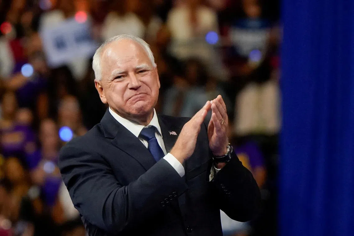 FILE PHOTO: Vice presidential nominee Minnesota Governor Tim Walz applauds during a campaign rally with U.S. Vice President and Democratic presidential candidate Kamala Harris in Philadelphia, Pennsylvania, U.S., August 6, 2024. REUTERS/Elizabeth Frantz/File Photo