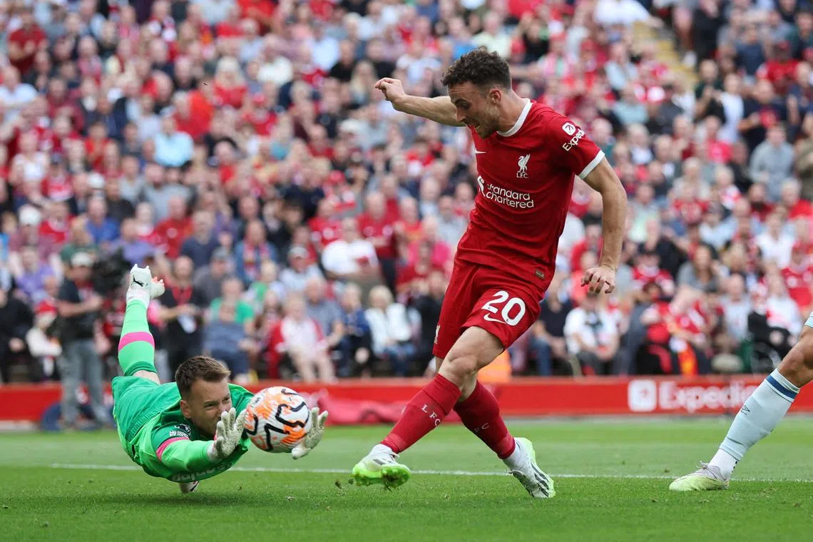 Liverpool's Diogo Jota scores their third goal.
