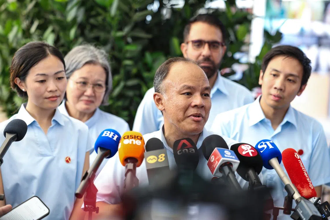 Workers' Party candidate Faisal Manap speaks to the media during a doorstop in Tampines on April 28.