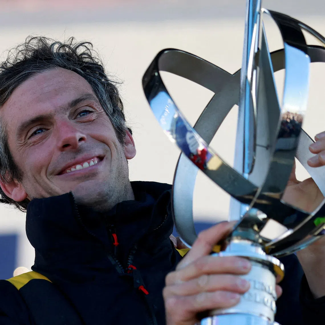 FILE PHOTO: Sailing - Arrival of the Vendee Globe winner - Les Sables-d'Olonne, France - January 14, 2025 Macif Sante Prevoyance's Charlie Dalin holds the trophy onstage as he arrives in port after winning the Vendee Globe REUTERS/Stephane Mahe/File Photo