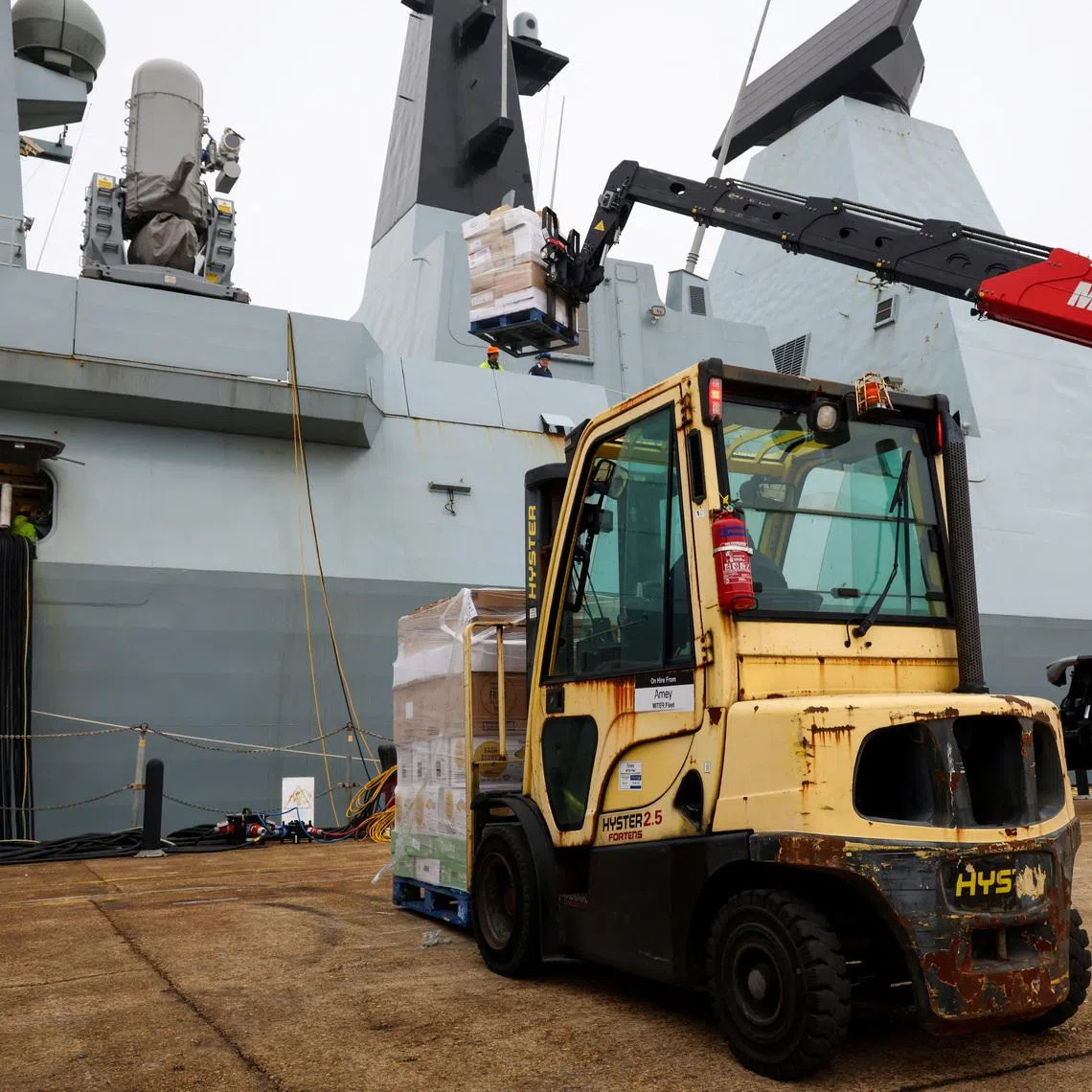 Supplies are loaded on HMS Dragon as it prepares to deploy to the Mediterranean, in Portsmouth, Britain, March 8, 2026. PO Phot Chris Sellars/UK MOD/Handout via REUTERS