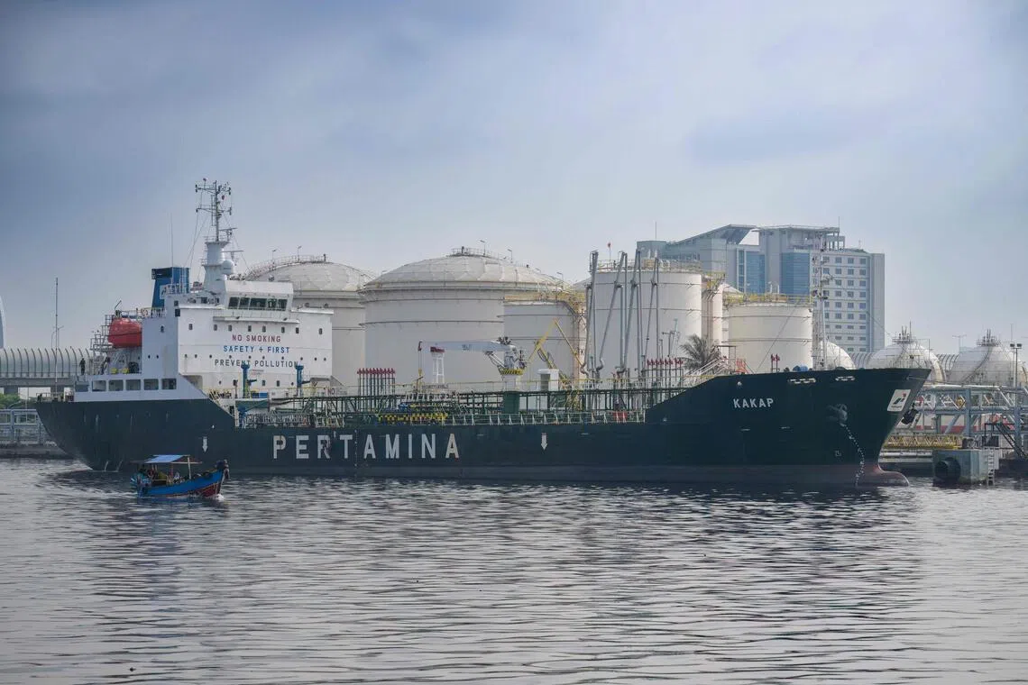 A ship bearing the logo of state-owned oil company Pertamina is anchored at a port near an oil depot in Tanjung Priok Port, Jakarta, on March 31, 2026. 
