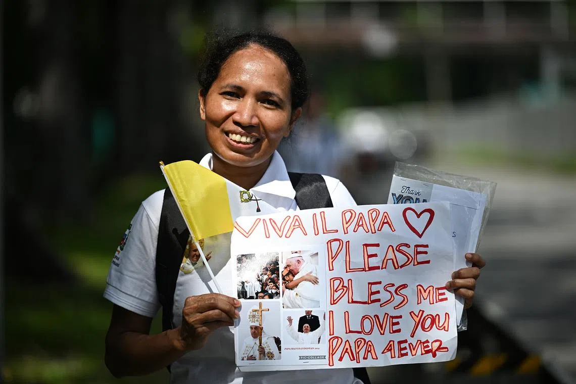 ST20240913-202482000367-Lim Yaohui-pixpope13/ Ms Diana Tamonob, 36, domestic helper from Indonesia, arrived outside Catholic Junior College since 6.45am and wanted to pass a letter to Pope Francis. People waiting for Pope Francis' arrival at the entrance of Catholic Junior College on Sept 13, 2024. Pope Francis will be visiting Catholic Junior College for Interfaith dialogue. (ST PHOTO: LIM YAOHUI)
