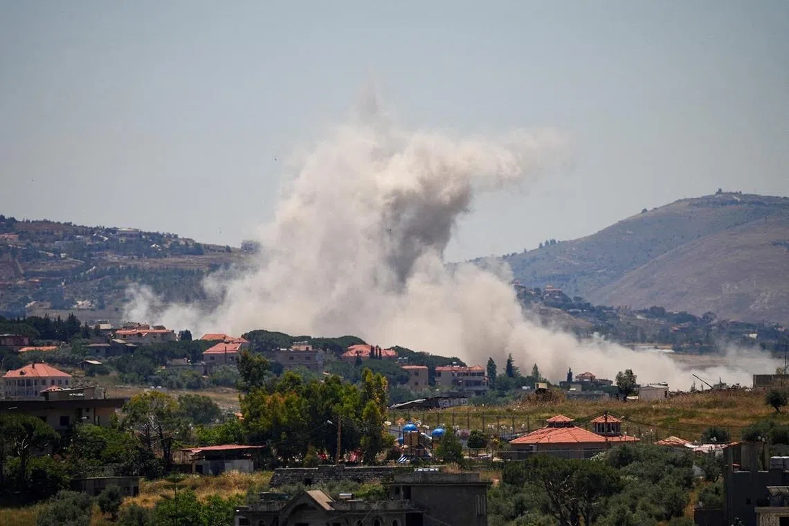 Smoke billowing in southern Lebanon following Israeli strikes, as seen from Nabatieh, Lebanon, June 4.