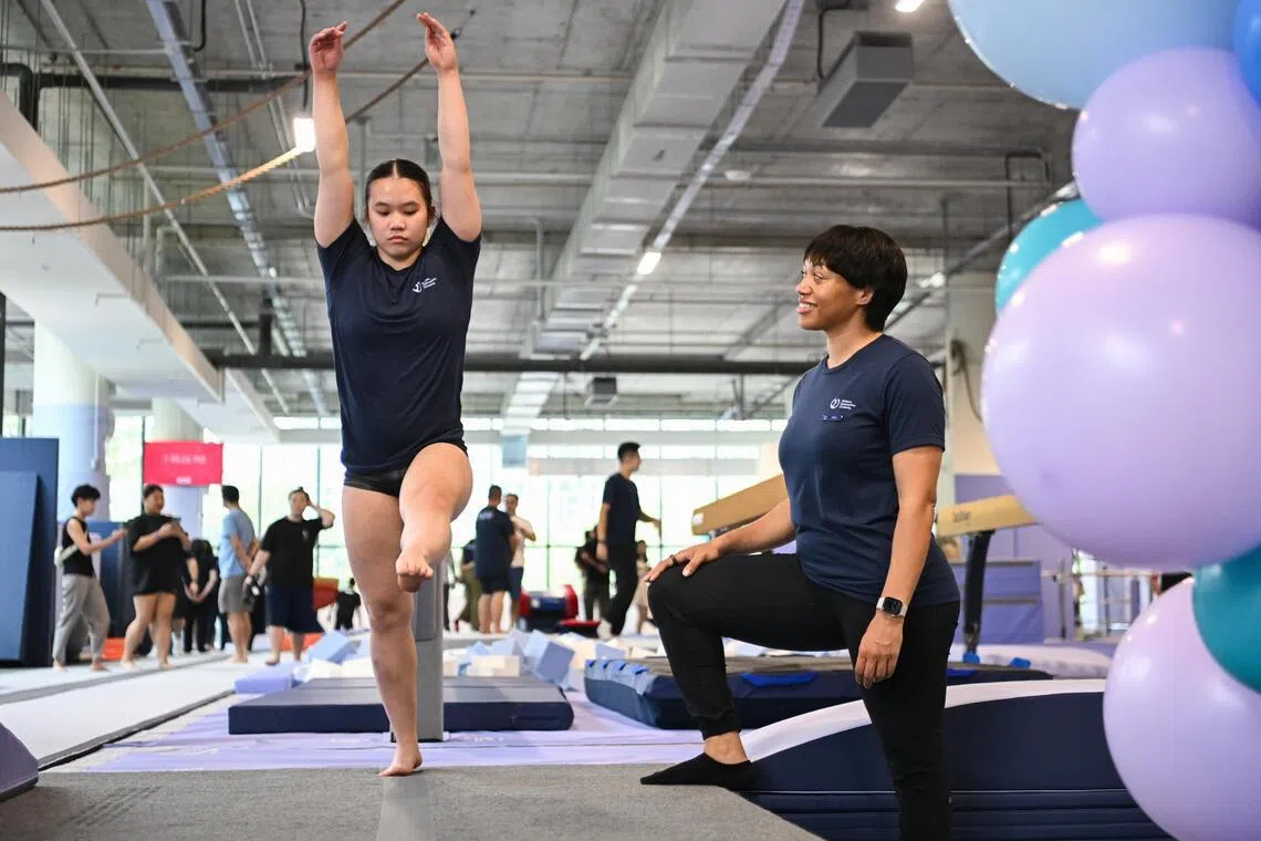 Riley Lee (left) and American coach Cleo Washington at the launch of the Mokara Gymnastics Academy at the Perennial Business City in Jurong East on April 3, 2026. 