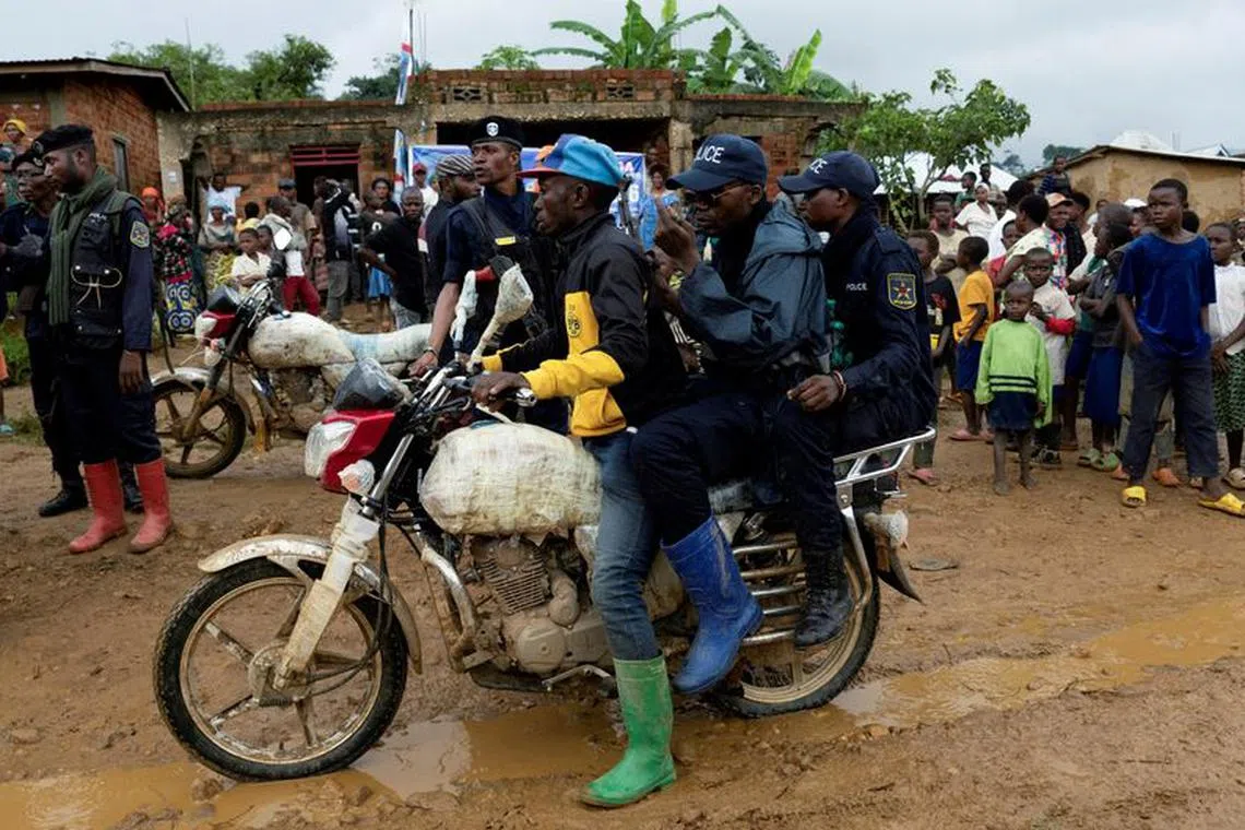 FILE PHOTO: Congolese police officers secure the streets during a campaign rally of presidential candidate Moise Katumbi in Kitutu village within Mwenga territory of South Kivu province, Democratic Republic of the Congo November 24, 2023. REUTERS/Arlette Bashizi/File Photo/File Photo